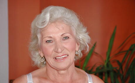 Sultry grandma Norma in hot undies shows big hooters and toys her twat 