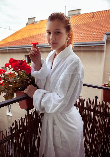 Sexy red-haired young Ambre in underwear exposing her ass and shaved pussy outdoor